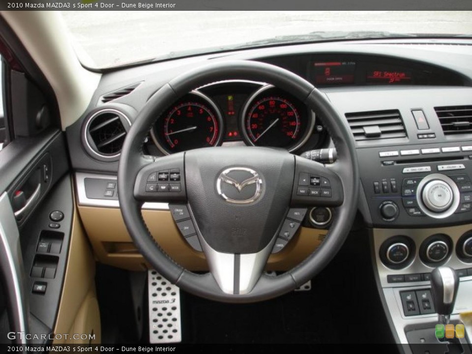 Dune Beige Interior Steering Wheel for the 2010 Mazda MAZDA3 s Sport 4 Door #48475137