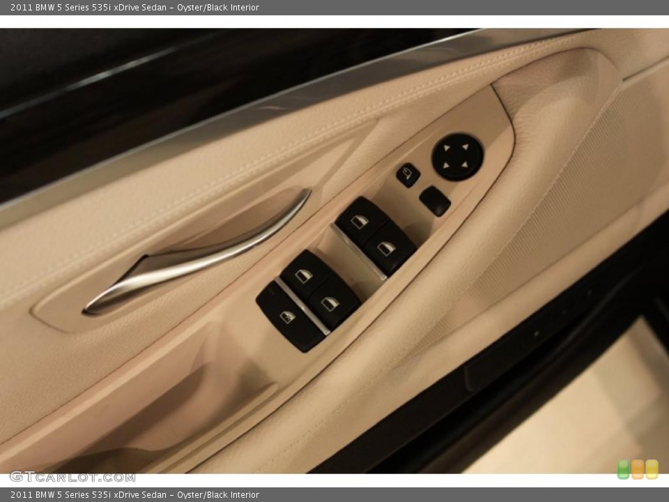 Oyster/Black Interior Controls for the 2011 BMW 5 Series 535i xDrive Sedan #48611594