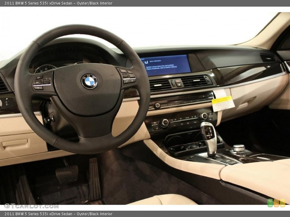 Oyster/Black Interior Dashboard for the 2011 BMW 5 Series 535i xDrive Sedan #48611654