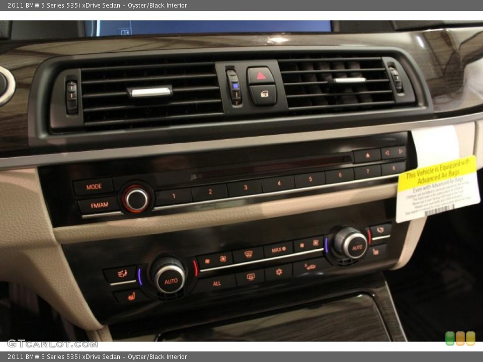 Oyster/Black Interior Controls for the 2011 BMW 5 Series 535i xDrive Sedan #48611708