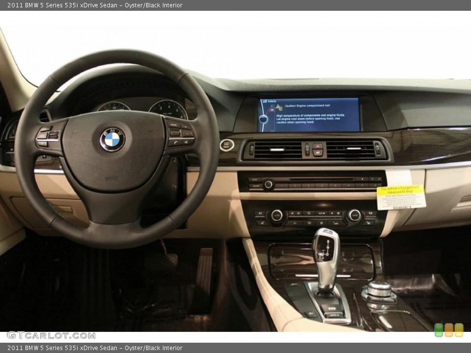 Oyster/Black Interior Dashboard for the 2011 BMW 5 Series 535i xDrive Sedan #48611805