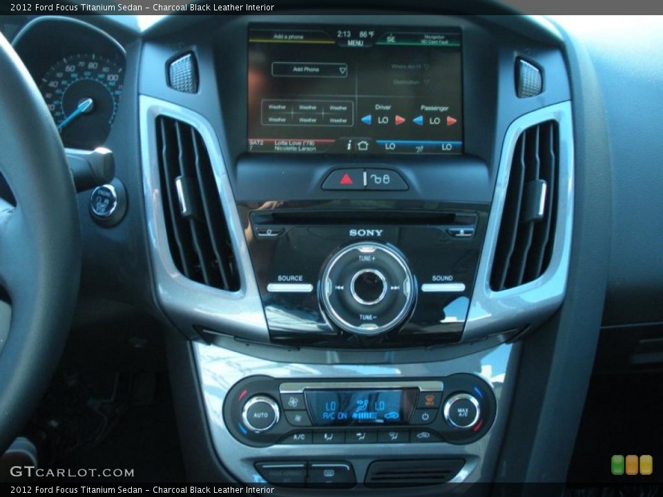 Charcoal Black Leather Interior Controls for the 2012 Ford Focus Titanium Sedan #48634116