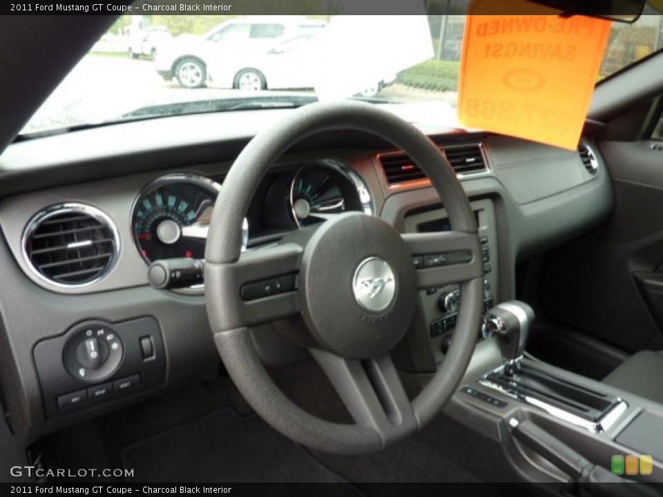 Charcoal Black Interior Steering Wheel for the 2011 Ford Mustang GT Coupe #48720995