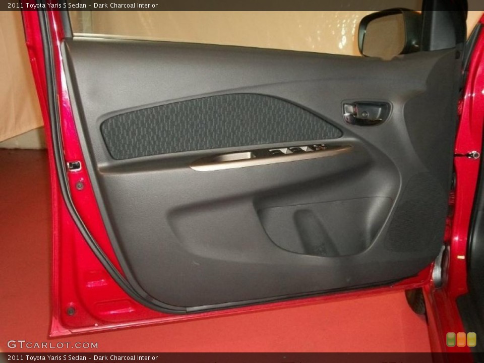 Dark Charcoal Interior Door Panel for the 2011 Toyota Yaris S Sedan #48767725