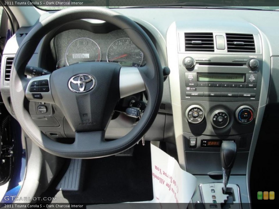 Dark Charcoal Interior Steering Wheel for the 2011 Toyota Corolla S #48818355