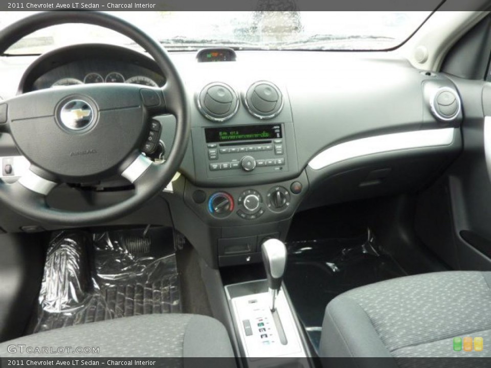 Charcoal Interior Dashboard for the 2011 Chevrolet Aveo LT Sedan #48850435