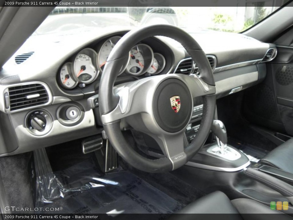 Black Interior Steering Wheel for the 2009 Porsche 911 Carrera 4S Coupe #48961825