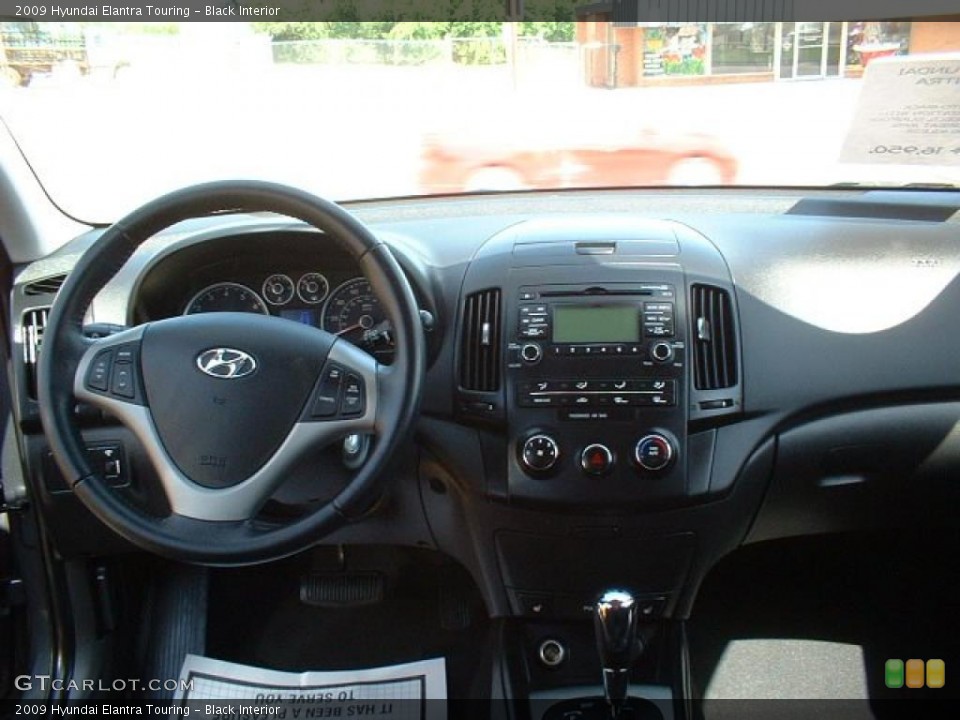 Black Interior Dashboard for the 2009 Hyundai Elantra Touring #49063172