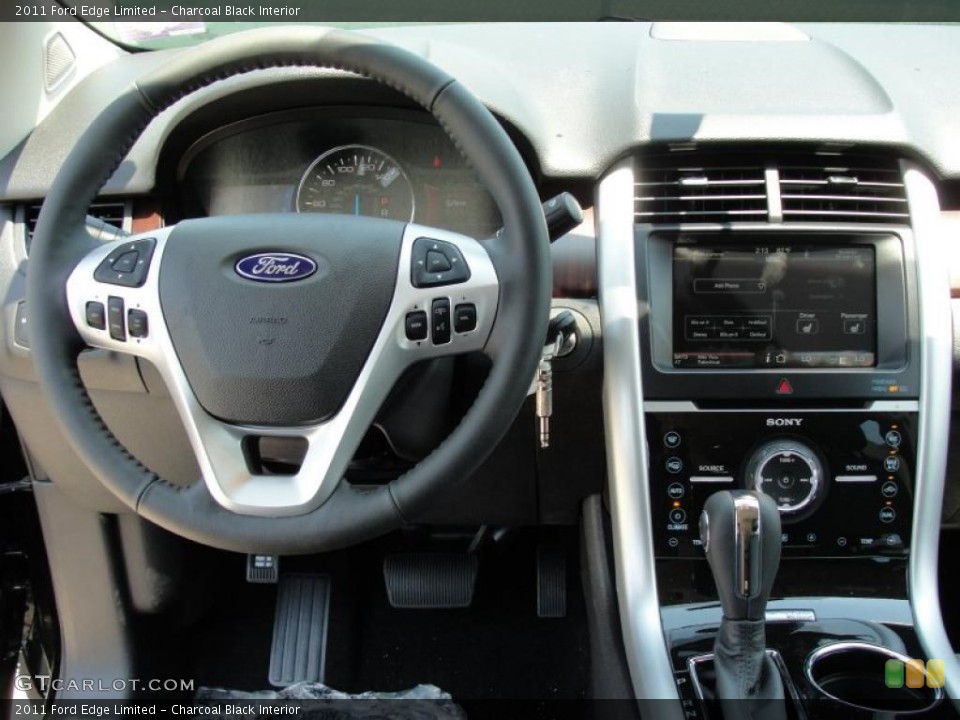 Charcoal Black Interior Steering Wheel for the 2011 Ford Edge Limited #49117049