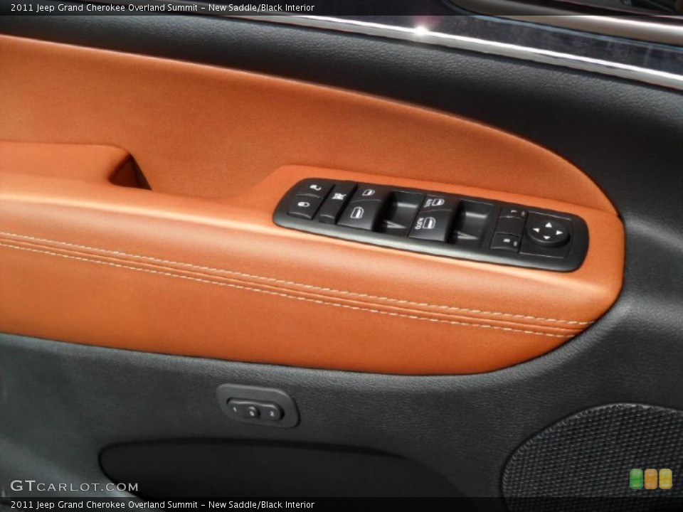 New Saddle/Black Interior Controls for the 2011 Jeep Grand Cherokee Overland Summit #49120103