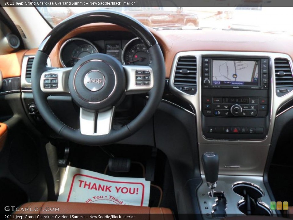 New Saddle/Black Interior Dashboard for the 2011 Jeep Grand Cherokee Overland Summit #49120253