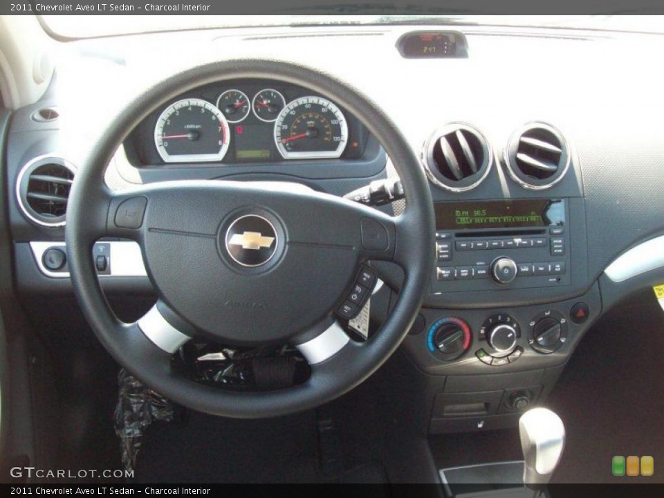 Charcoal Interior Dashboard for the 2011 Chevrolet Aveo LT Sedan #49128293