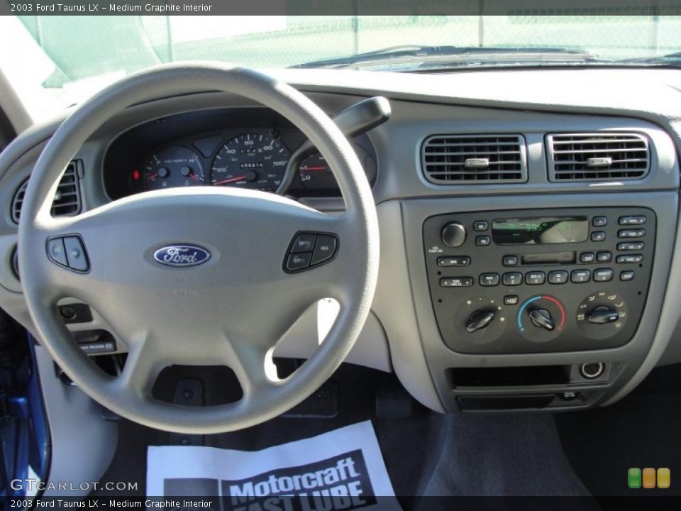 Medium Graphite Interior Dashboard for the 2003 Ford Taurus LX #49130385