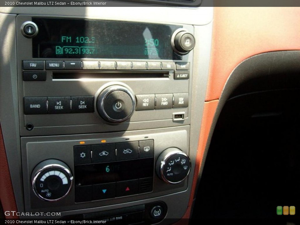 Ebony/Brick Interior Controls for the 2010 Chevrolet Malibu LTZ Sedan #49137905