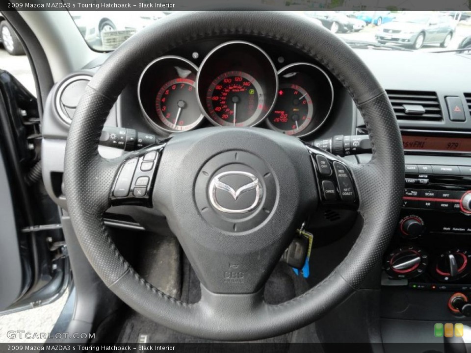 Black Interior Steering Wheel for the 2009 Mazda MAZDA3 s Touring Hatchback #49196945