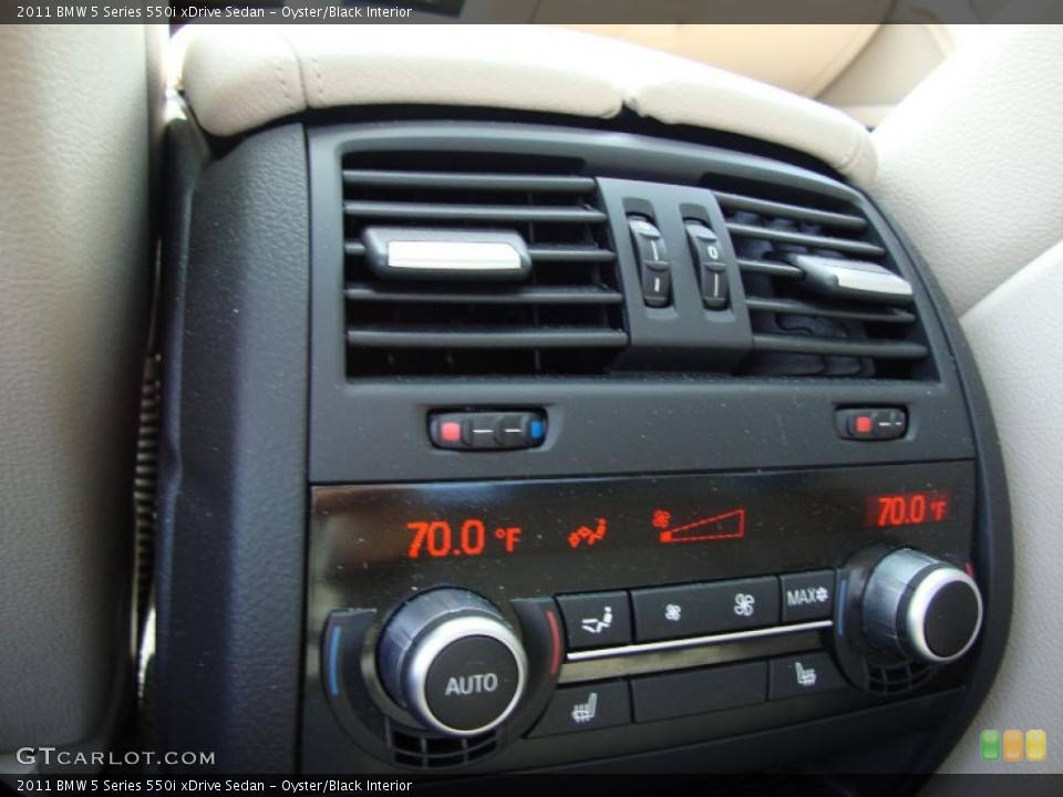Oyster/Black Interior Controls for the 2011 BMW 5 Series 550i xDrive Sedan #49295291