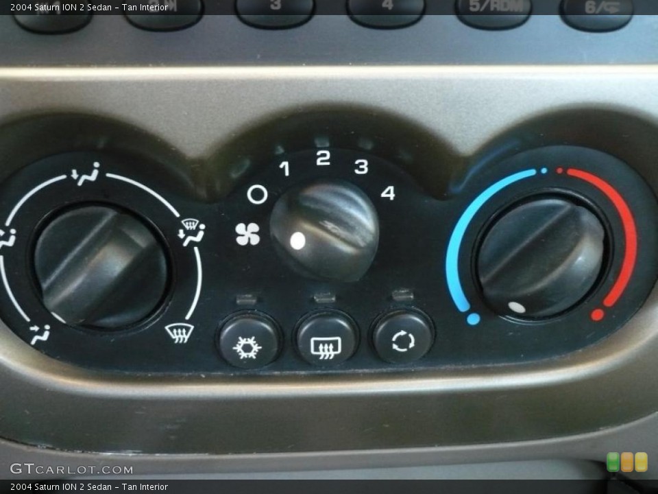 Tan Interior Controls for the 2004 Saturn ION 2 Sedan #49323324