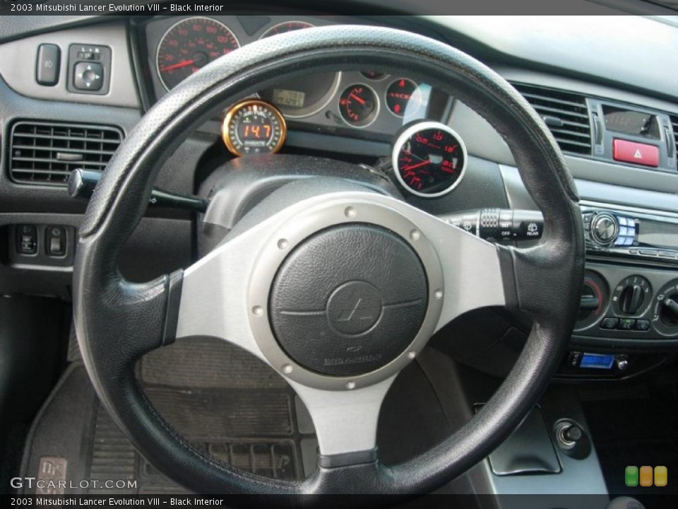 Black Interior Steering Wheel for the 2003 Mitsubishi Lancer Evolution VIII #49363799