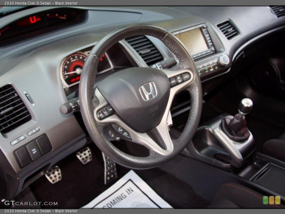 Black Interior Steering Wheel for the 2010 Honda Civic Si Sedan #49377974