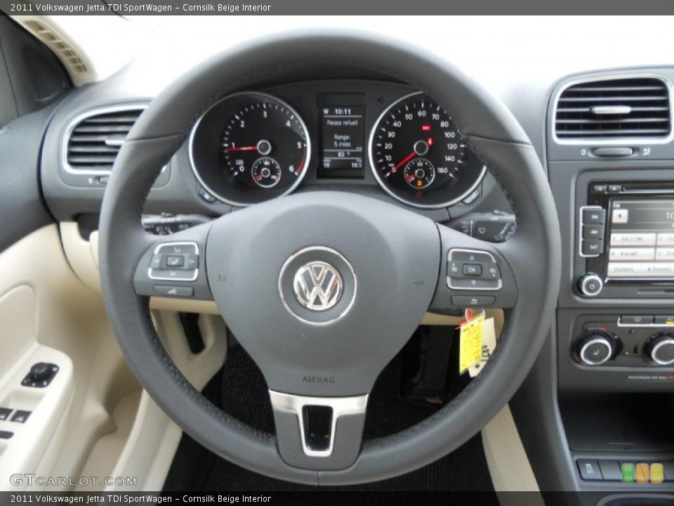 Cornsilk Beige Interior Steering Wheel for the 2011 Volkswagen Jetta TDI SportWagen #49613053