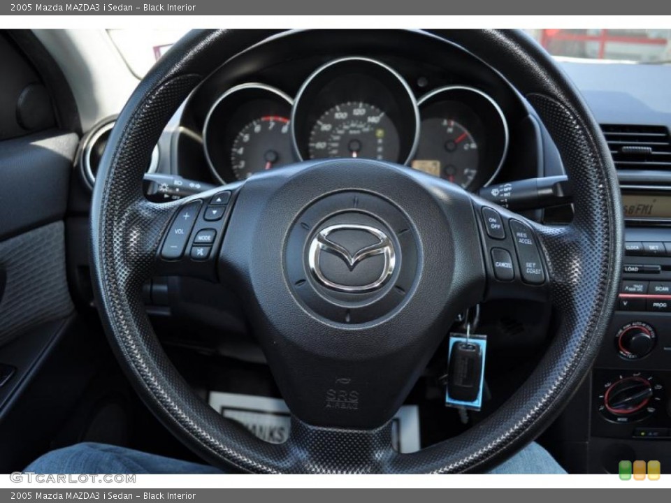 Black Interior Steering Wheel for the 2005 Mazda MAZDA3 i Sedan #49823922