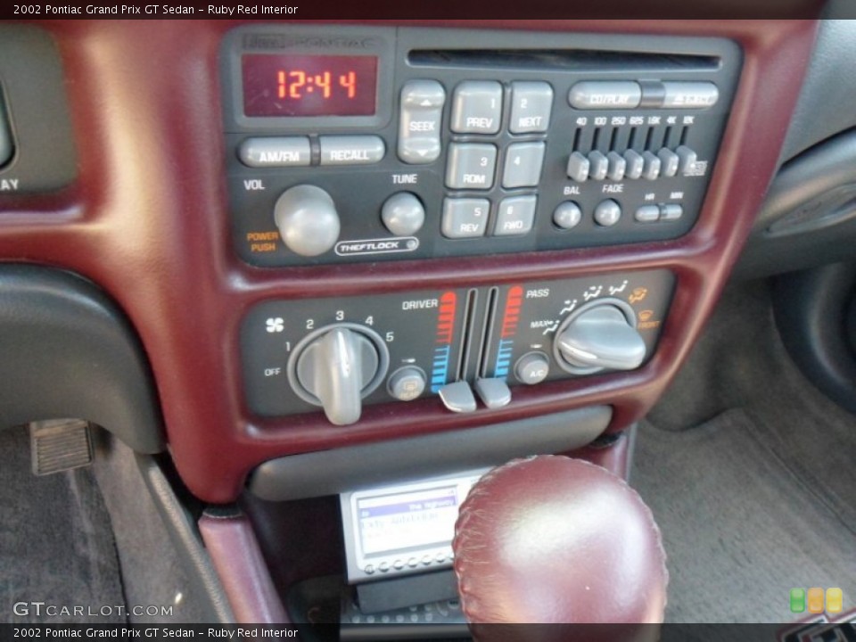 Ruby Red Interior Controls for the 2002 Pontiac Grand Prix GT Sedan #50163623