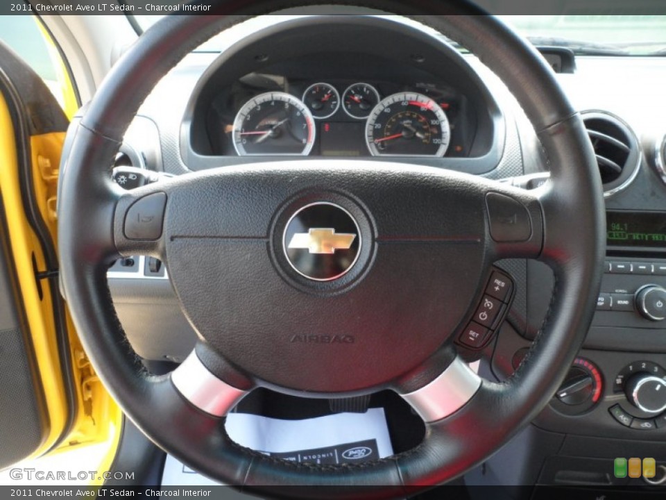 Charcoal Interior Steering Wheel for the 2011 Chevrolet Aveo LT Sedan #50232847