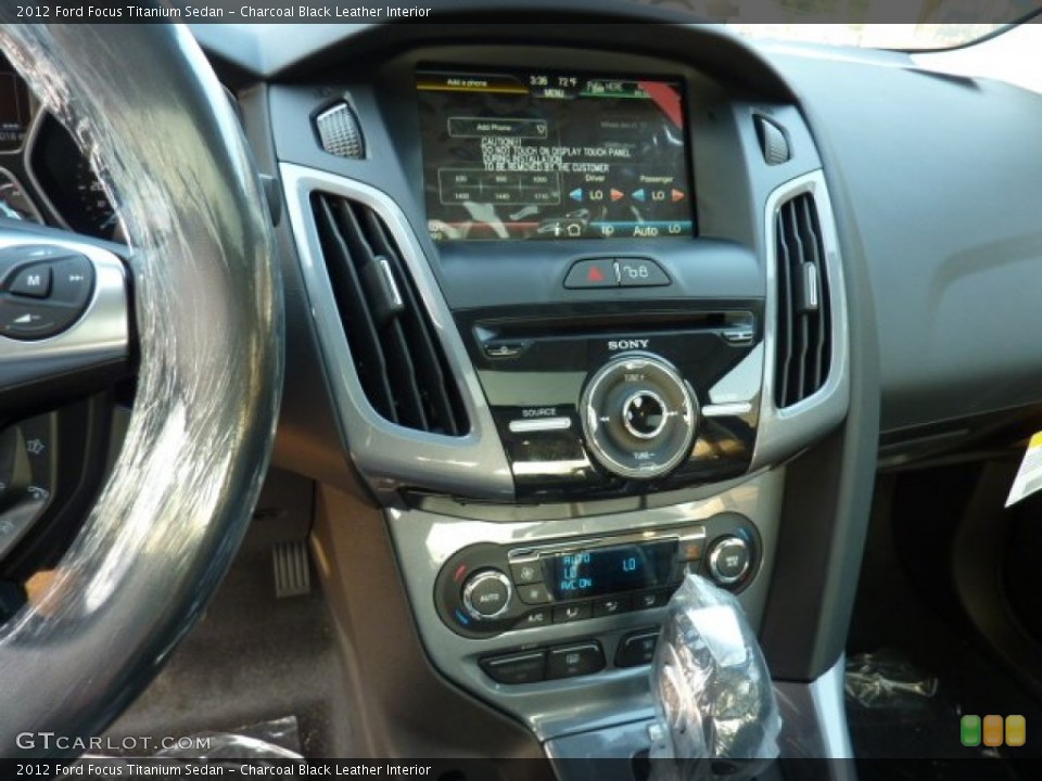 Charcoal Black Leather Interior Controls for the 2012 Ford Focus Titanium Sedan #50277741