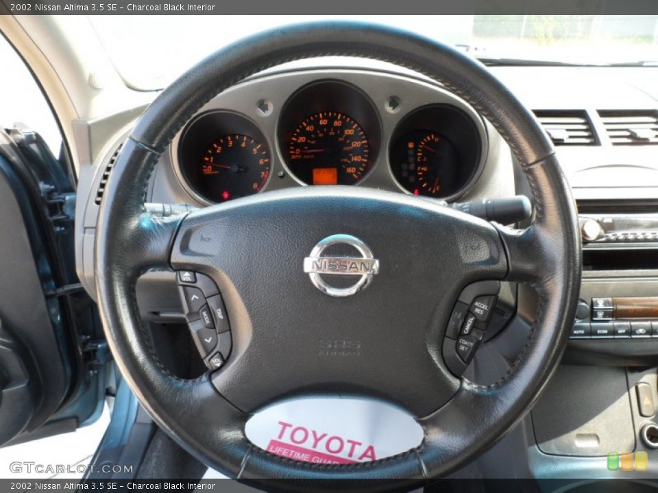 Charcoal Black Interior Steering Wheel for the 2002 Nissan Altima 3.5 SE #50417146