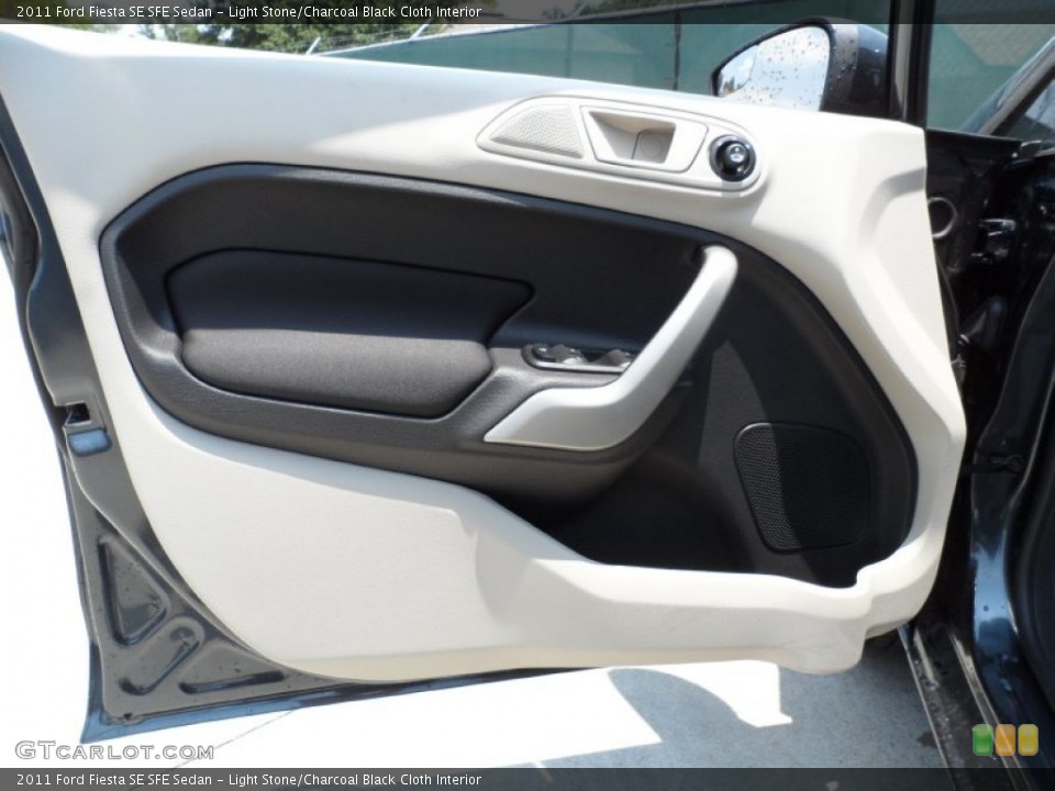 Light Stone/Charcoal Black Cloth Interior Door Panel for the 2011 Ford Fiesta SE SFE Sedan #50468090