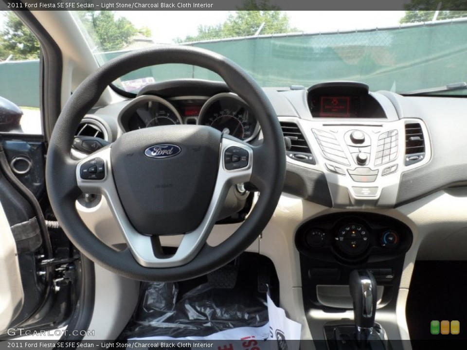 Light Stone/Charcoal Black Cloth Interior Dashboard for the 2011 Ford Fiesta SE SFE Sedan #50468149