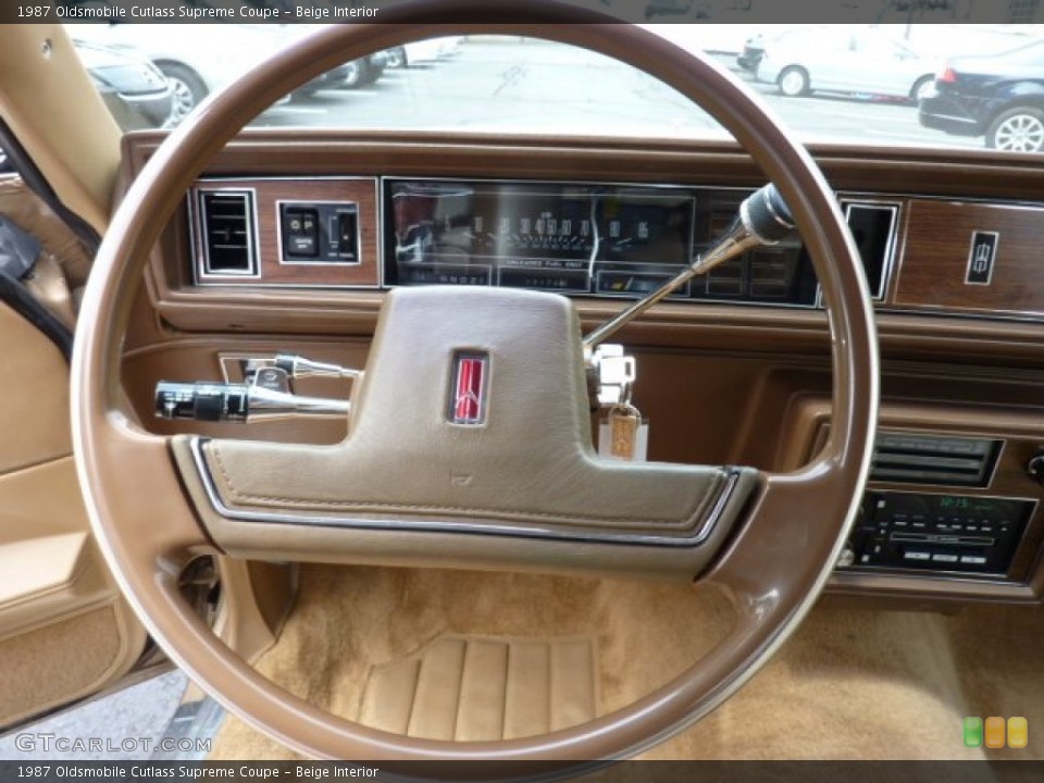 Beige Interior Steering Wheel for the 1987 Oldsmobile Cutlass Supreme Coupe #50610573