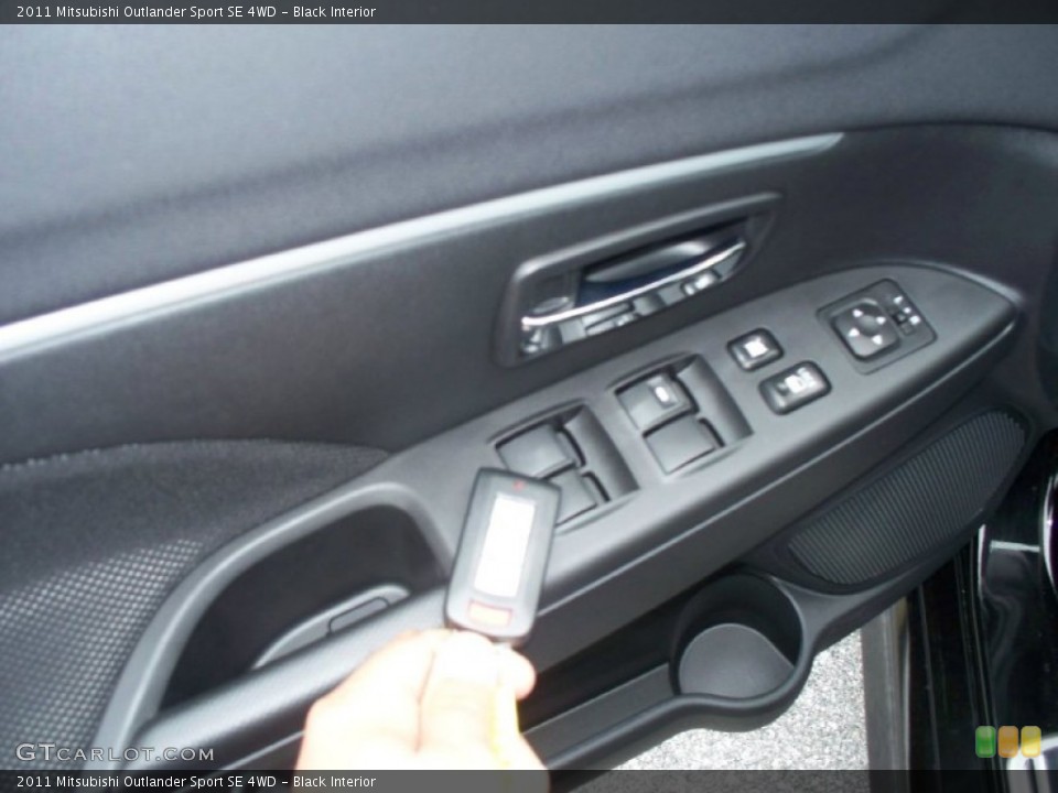 Black Interior Controls for the 2011 Mitsubishi Outlander Sport SE 4WD #50628186