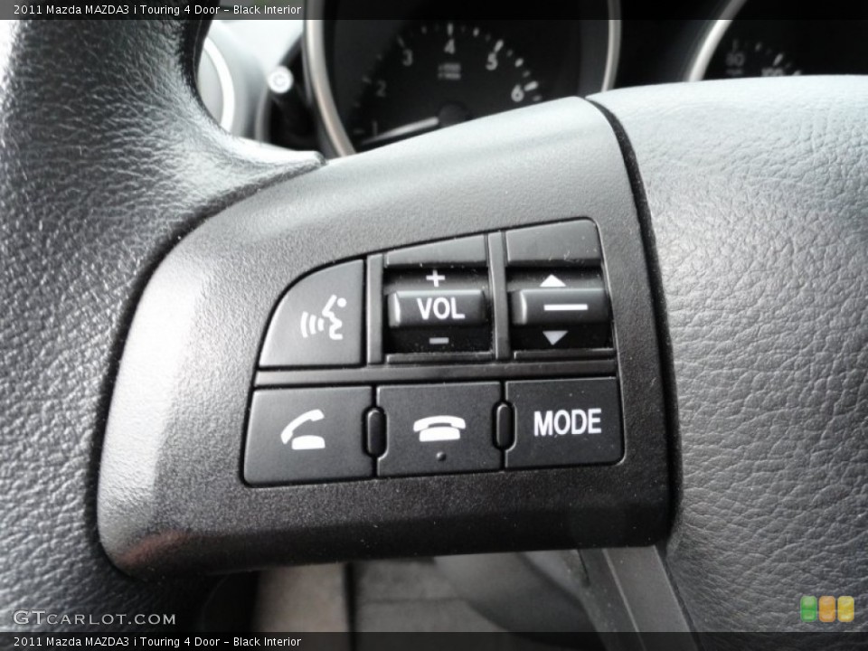 Black Interior Controls for the 2011 Mazda MAZDA3 i Touring 4 Door #50655271