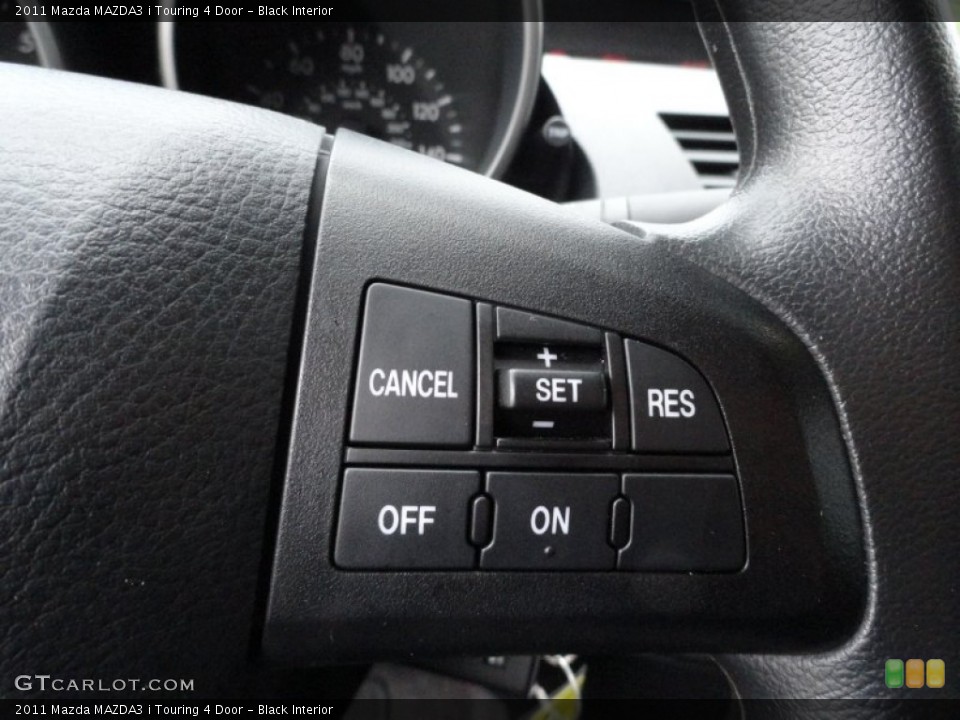 Black Interior Controls for the 2011 Mazda MAZDA3 i Touring 4 Door #50655295