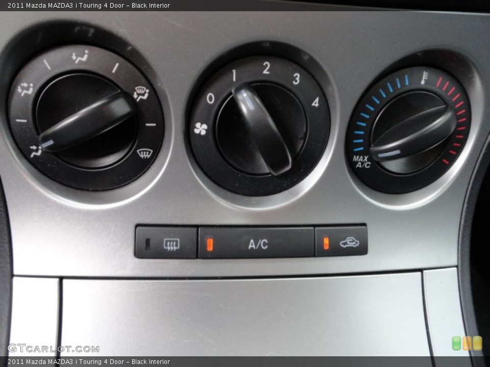Black Interior Controls for the 2011 Mazda MAZDA3 i Touring 4 Door #50655370