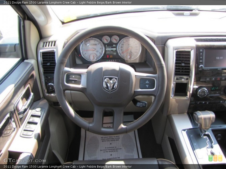 Light Pebble Beige/Bark Brown Interior Steering Wheel for the 2011 Dodge Ram 1500 Laramie Longhorn Crew Cab #50739291