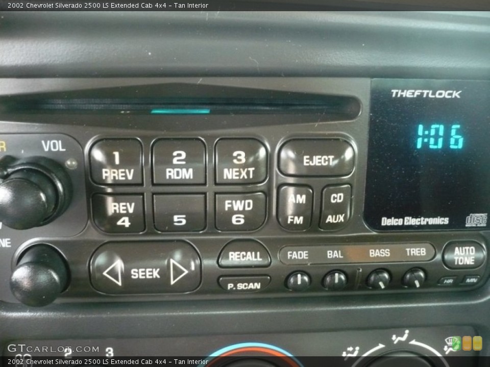 Tan Interior Controls for the 2002 Chevrolet Silverado 2500 LS Extended Cab 4x4 #50763426