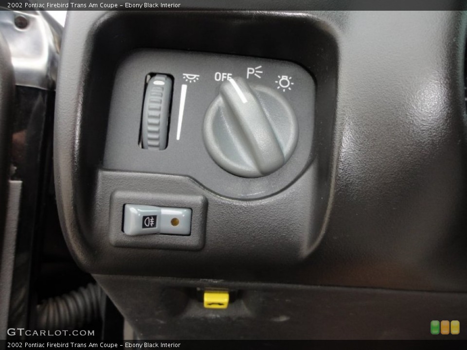 Ebony Black Interior Controls for the 2002 Pontiac Firebird Trans Am Coupe #50792541