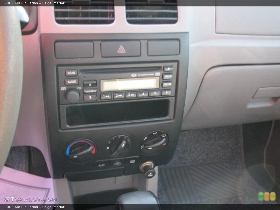 Beige Interior Controls for the 2003 Kia Rio Sedan #50849115