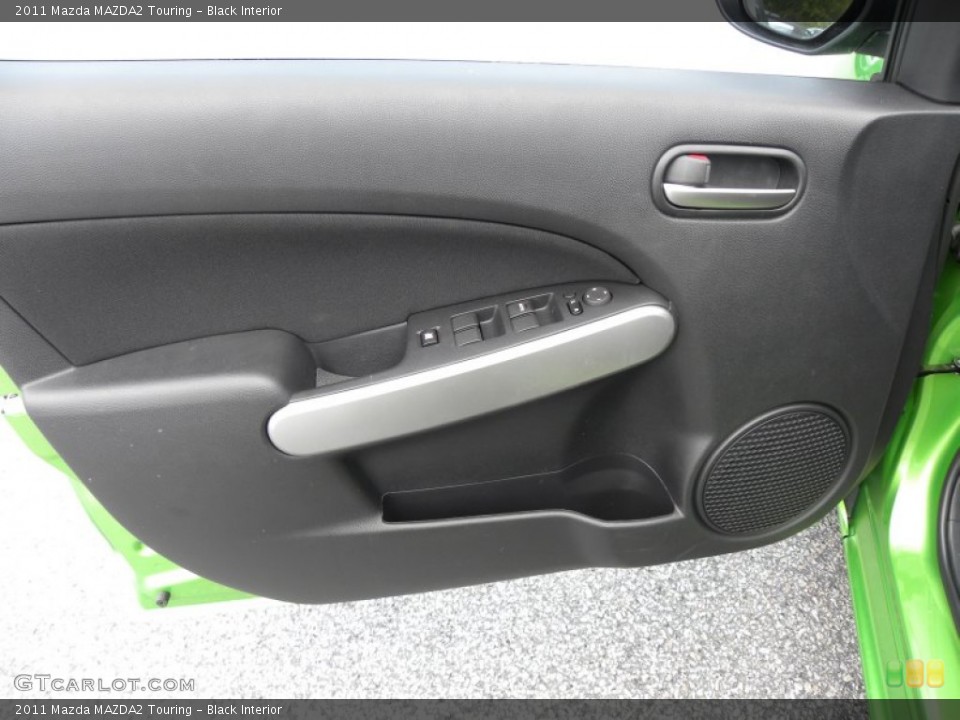 Black Interior Door Panel for the 2011 Mazda MAZDA2 Touring #51028522