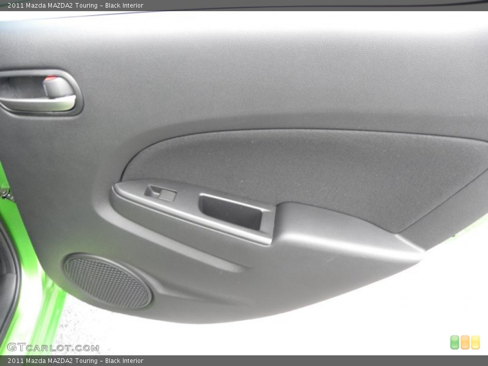 Black Interior Door Panel for the 2011 Mazda MAZDA2 Touring #51028612