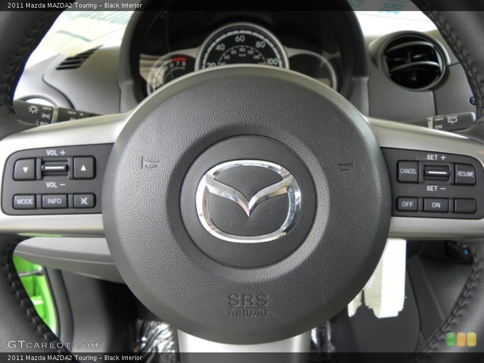 Black Interior Steering Wheel for the 2011 Mazda MAZDA2 Touring #51028768
