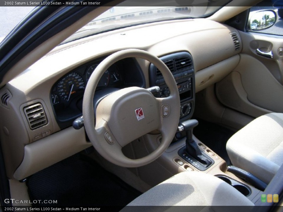 Medium Tan Interior Photo for the 2002 Saturn L Series L100 Sedan #51177933