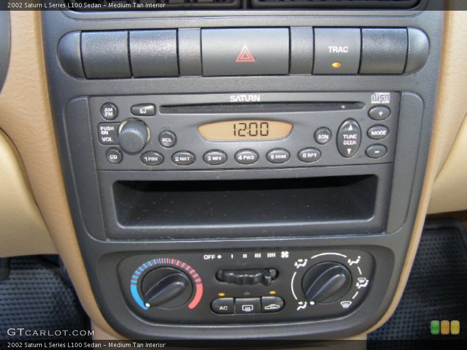 Medium Tan Interior Controls for the 2002 Saturn L Series L100 Sedan #51178017