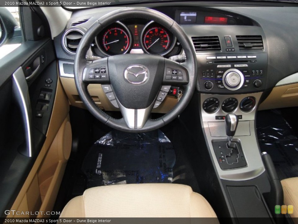 Dune Beige Interior Dashboard for the 2010 Mazda MAZDA3 s Sport 5 Door #51220811