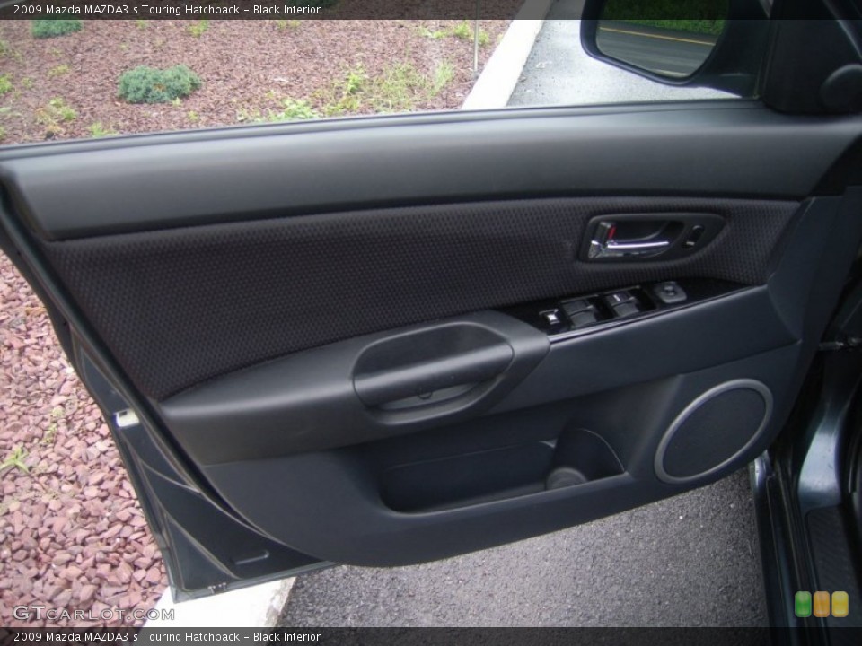 Black Interior Door Panel for the 2009 Mazda MAZDA3 s Touring Hatchback #51360749