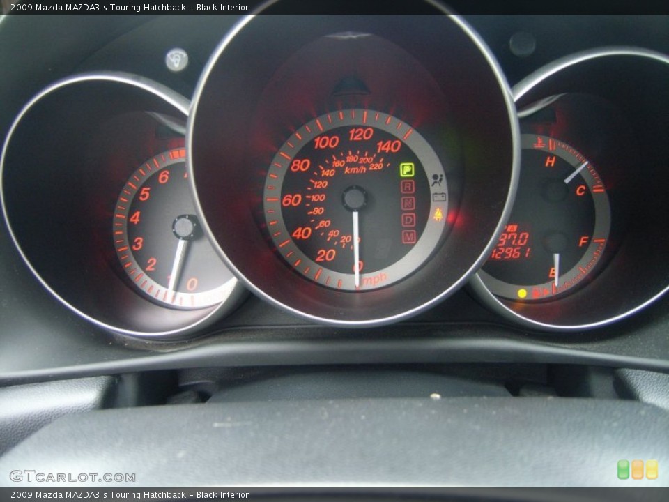 Black Interior Gauges for the 2009 Mazda MAZDA3 s Touring Hatchback #51360884