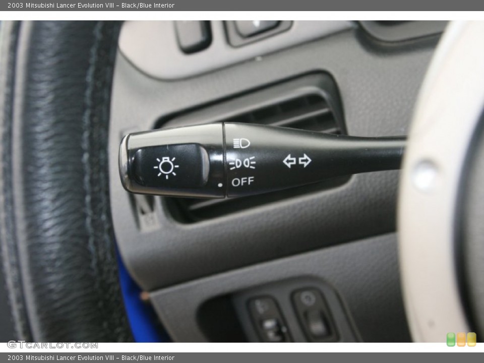 Black/Blue Interior Controls for the 2003 Mitsubishi Lancer Evolution VIII #51476778