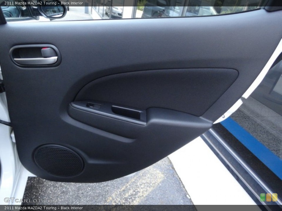 Black Interior Door Panel for the 2011 Mazda MAZDA2 Touring #51654343
